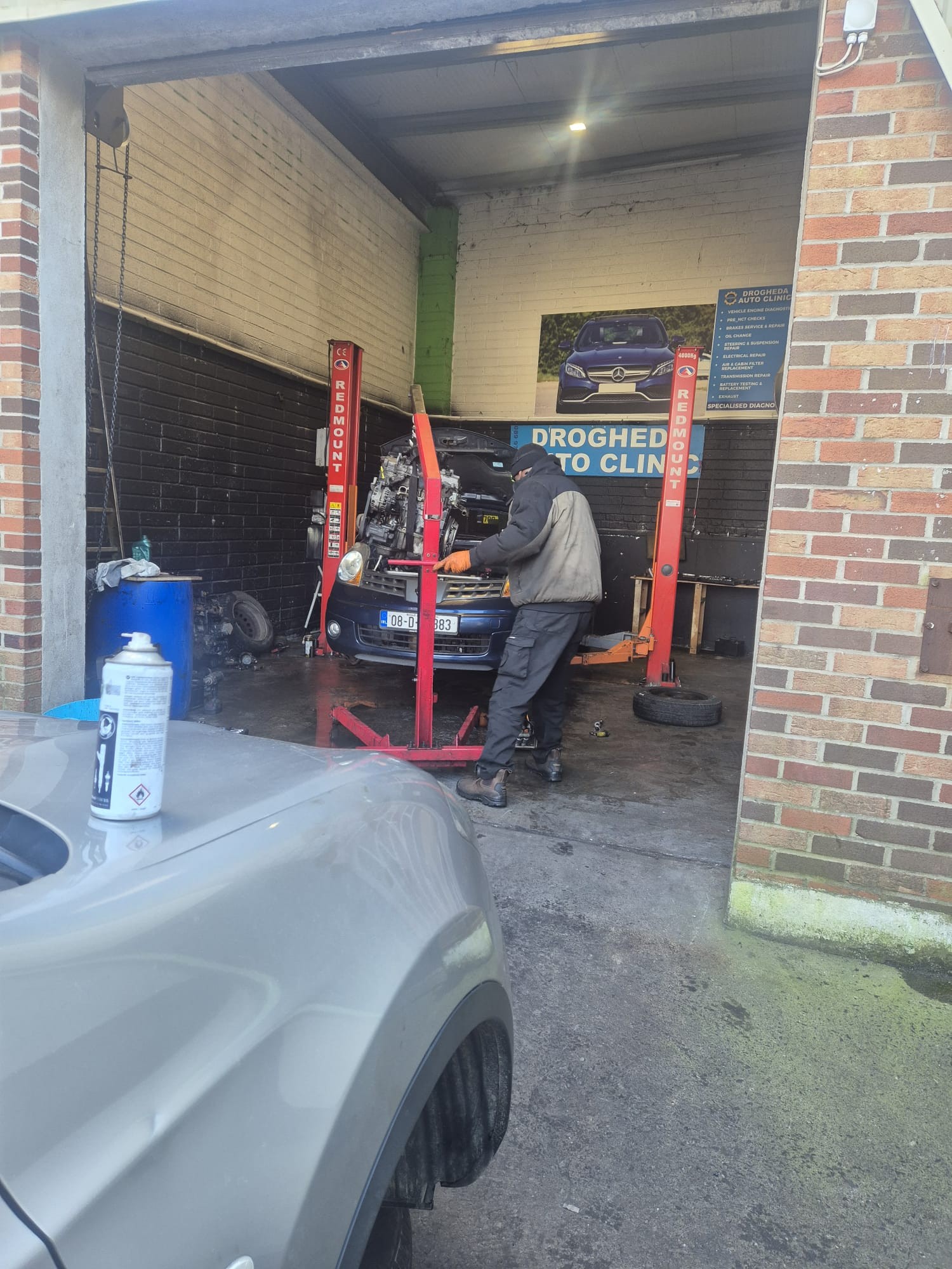 Mechanic working under the bonnet